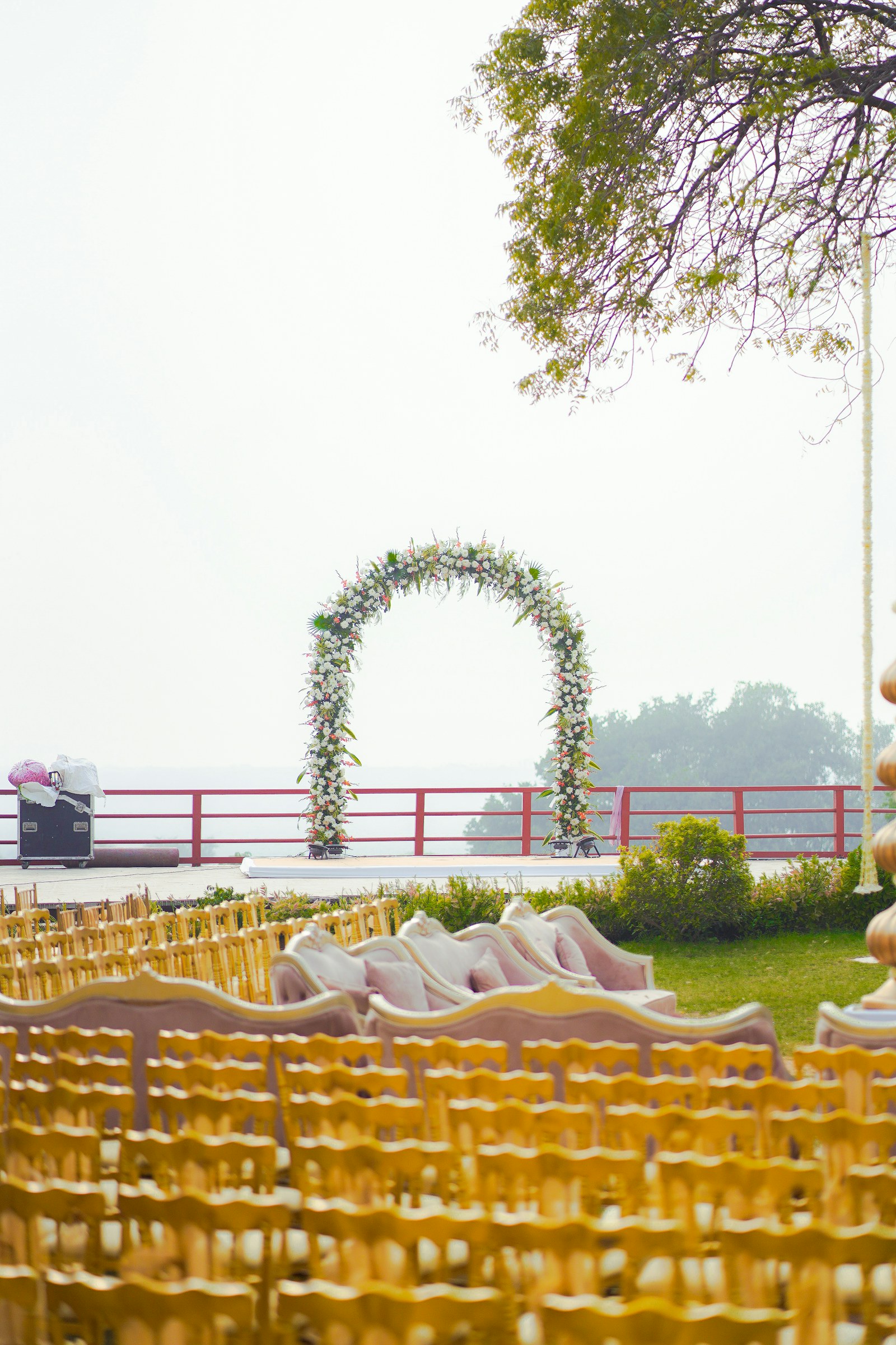 Indian wedding ceremony seating and floral arch